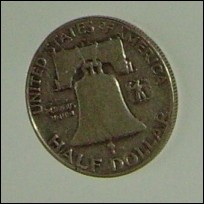 1958 Liberty bell / Ben Franklin Silver half dollar. G very worn