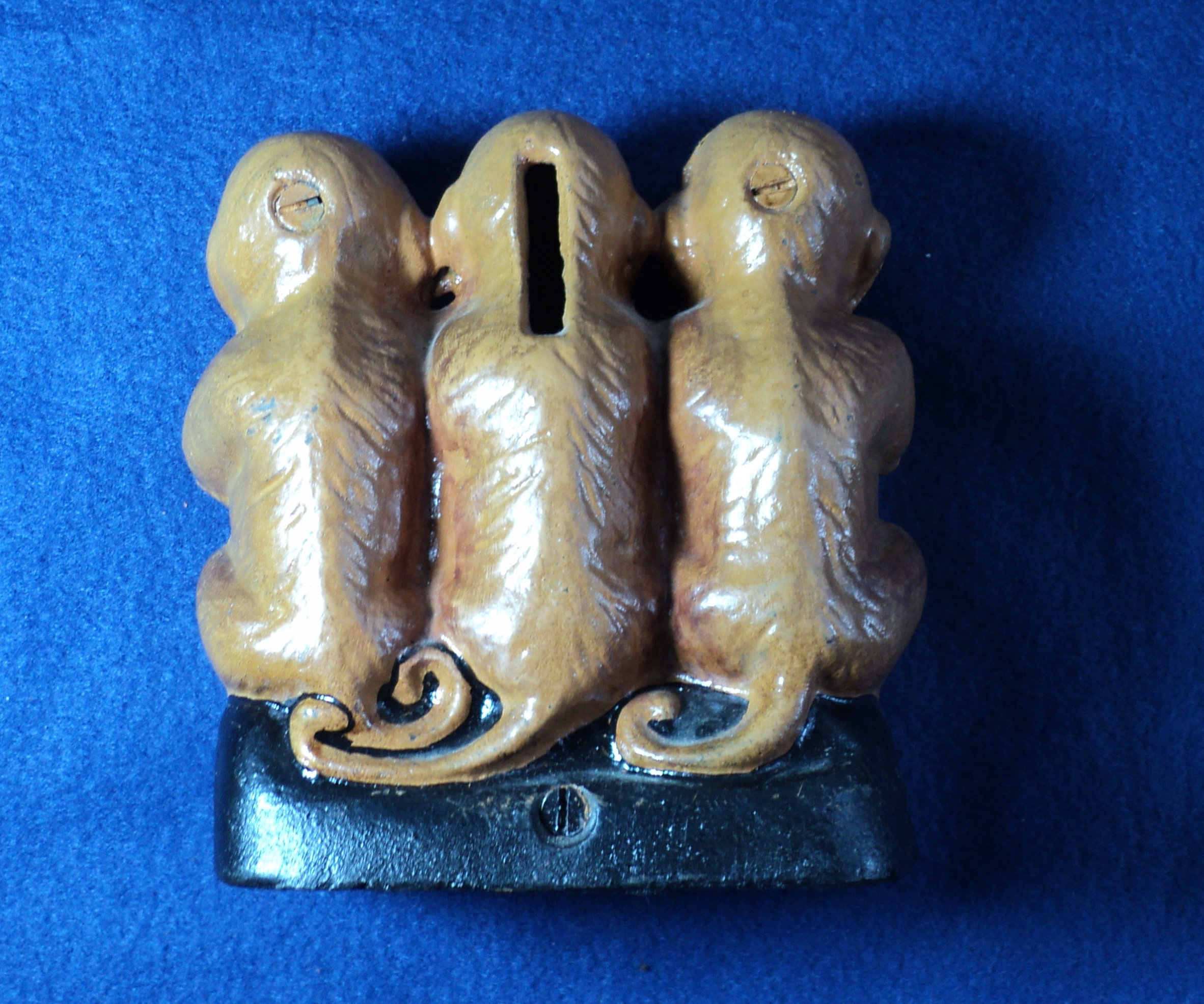 Three wise monkeys. Speak No Evil, See No Evil, Hear No Evil.  Cast Iron Metal Three Monkey Moneybox